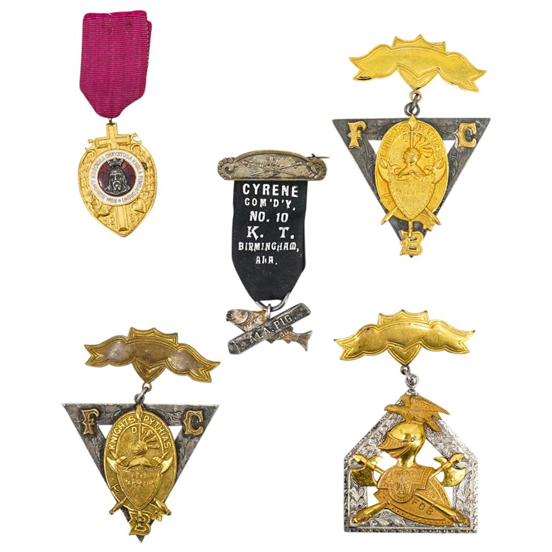 (5 Pc) Secret Society And Religious Medals: DESCRIPTION: Five medals from various fraternal and religious organizations including three from the Knights of Pythias, one from the Church Of Christ The King in Poland, and one labeled "CYRENE COM'D