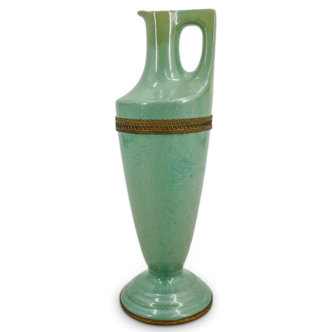 Mid Century Sarreguemines Celadon Tone Porcelain Ewer: DESCRIPTION: Sarreguemines porcelain ewer featuring a celadon tone, micro crystalline glaze and adorned with a gilt bronze, reticulated meandros ring around its body and a gilt bronze ring around its