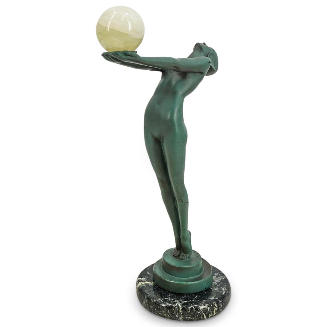 After Max Le Verrier (French, 1891-1973) "Clarte" Bronze Sculpture: DESCRIPTION: Art Deco bronze sculpture after French artist Max Le Verrier's (1891-1973) work titled "Clarte"; Depicting a standing nude woman with an arched back and outstretched arms holding a cream