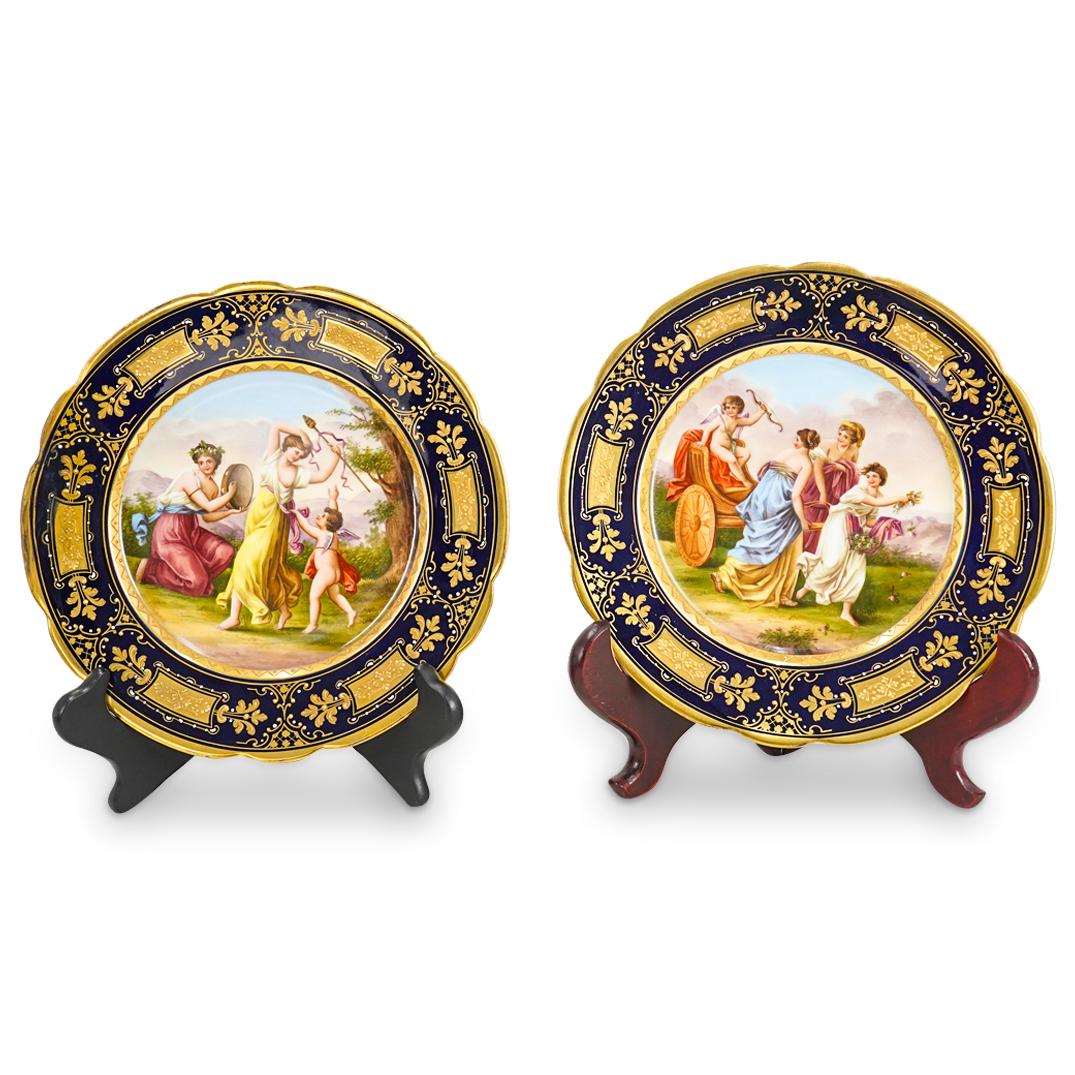 Pair Of Antique Royal Vienna Allegorical Porcelain Plates: DESCRIPTION: Two matching Royal Vienna porcelain plates, each decorated in its well with a famous allegorical painting: one labeled "Amour's Triumfzug" ("Love's Triumphal Procession") depicting eros o
