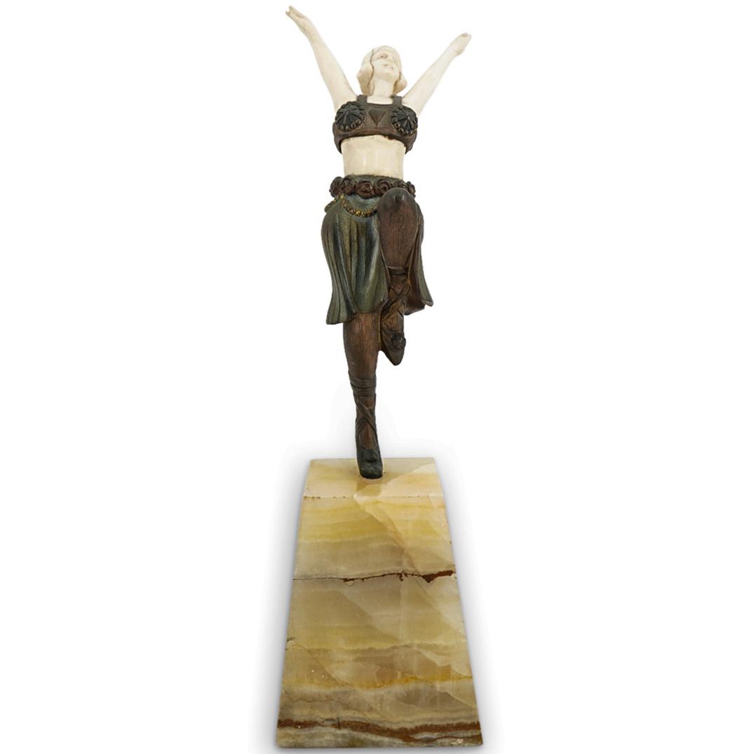 After Demetre Chiparus Erotic Art Deco Bronze And Bone Dancer: DESCRIPTION: Bone and bronze sculpture after Demetre Chiparus depicting a woman wearing dancer's garb while posing on one foot. Dancer's skin is composed of bone, clothing of bronze with gilt accents.