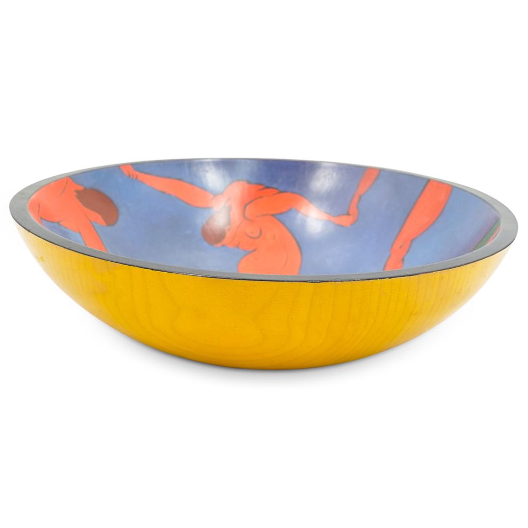 After Henri Matisse "La Danse" Painted Wood Bowl: DESCRIPTION: After Henri Matisse wood bowl painted in the well with his work titled "La Danse". Signed illegibly at the underside. CIRCA: 20th Century ORIGIN: Continental DIMENSIONS: H: 4.25" D: 13.87