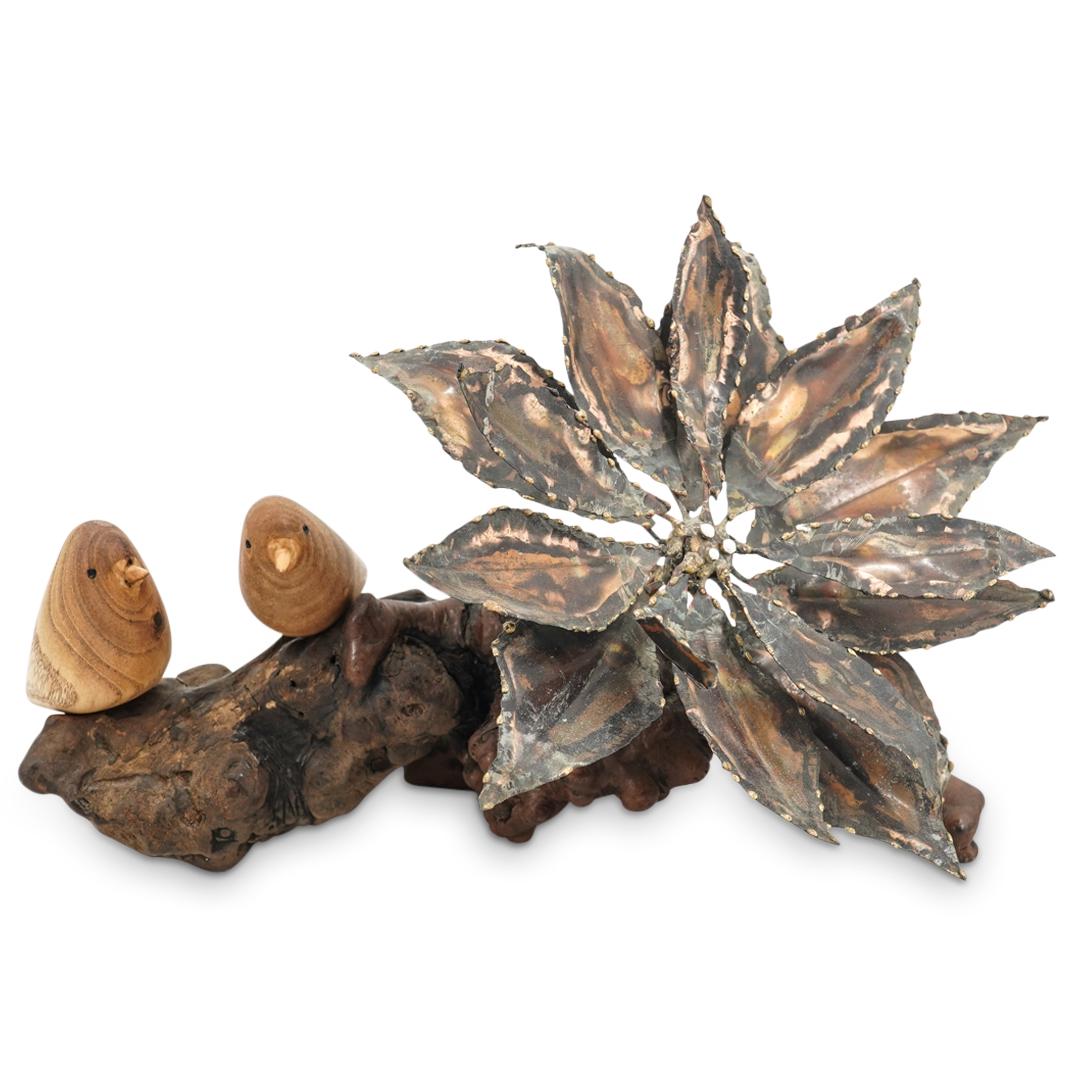 Curtis Jere Style Burlwood & Metal Sculpture: DESCRIPTION: Curtis Jere style sculpture comprising of a metal plant with rough edged leaves mounted in a naturalistic burl wood base alongside to minimalist carved wood birds. CIRCA: 20th Century ORI