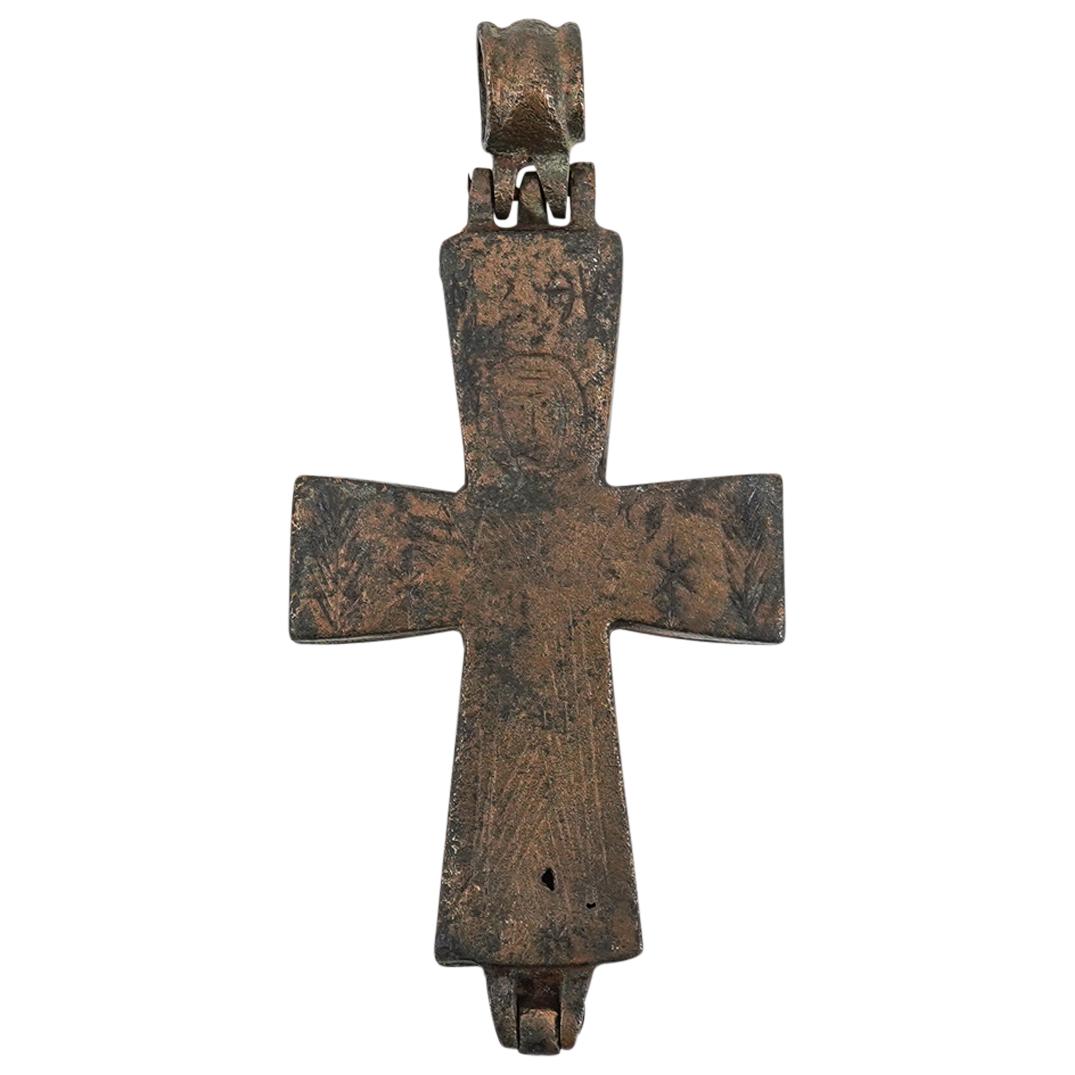 Ancient Byzantine Bronze Reliquary Cross: DESCRIPTION: Possibly ancient, Byzantine bronze reliquary cross formed of two halves, hinged at the base and pinned to a suspension loop above, one side engraved with a figure at center, with feathers