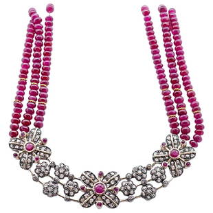 Indian 18k Gold, Sterling and Beaded Ruby Necklace: DESCRIPTION: An Indian necklace comprised of multi stranded beaded rubies, attached to a floral pendant crafted with sterling silver and 18k yellow gold, further decorated with a series of Round cut R