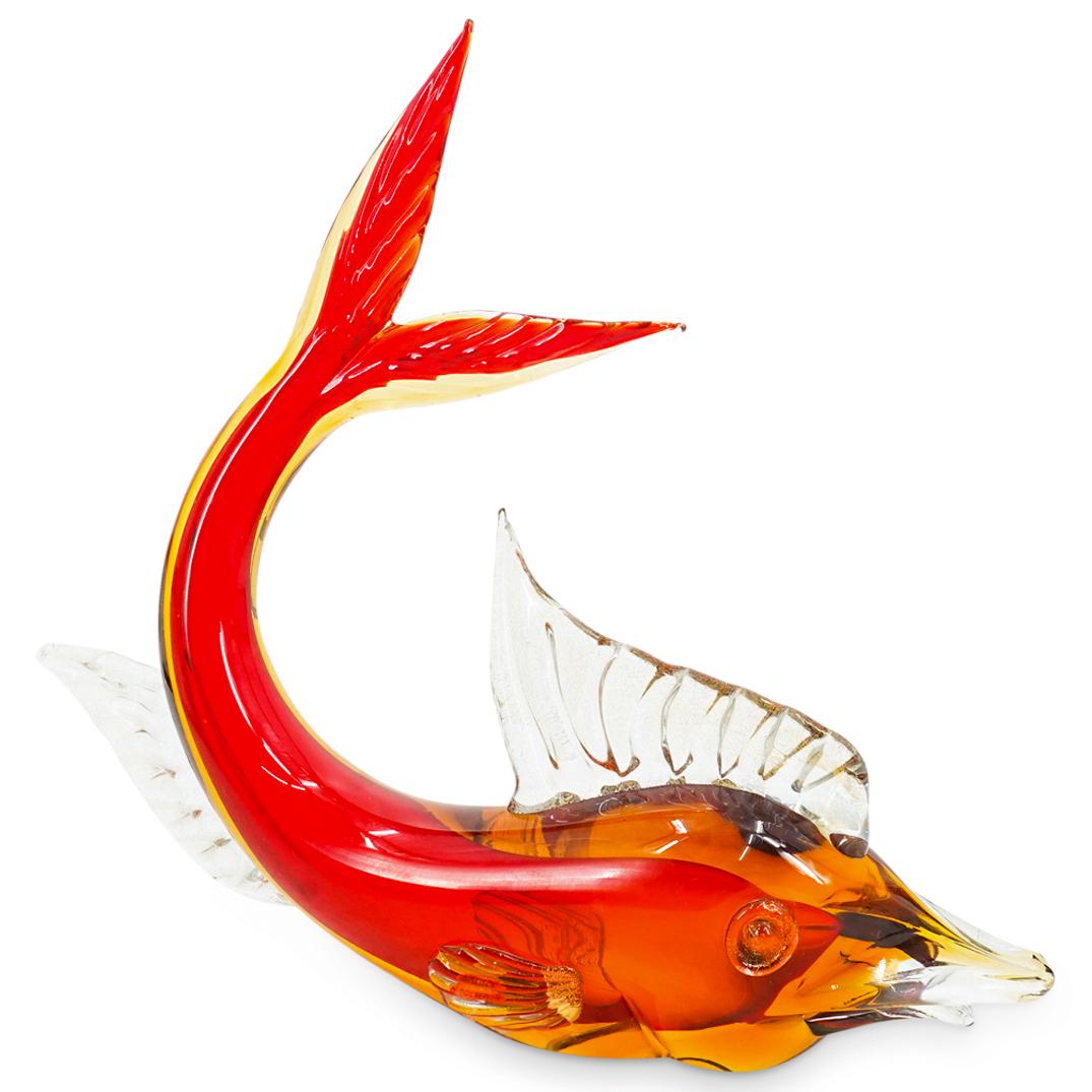 Murano Glass Fish Sculpture: DESCRIPTION: Murano glass sculpture of a red and orange fish with a curled tail and details of fins imbued with gold fleck. CIRCA: 20th Century ORIGIN: Italy DIMENSIONS: H: 15.12" W: 3.5" L: 17.25" Ha