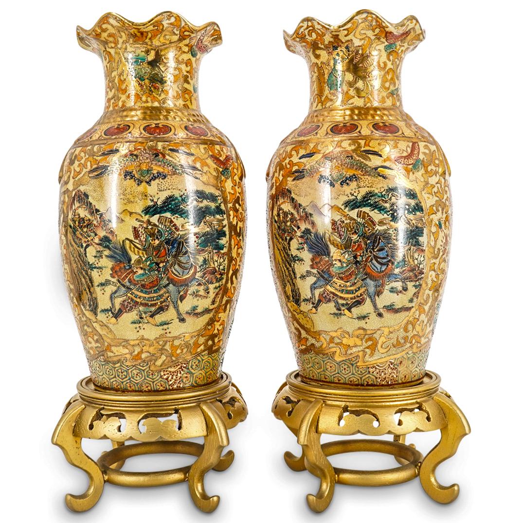 Pair Of Chinese Royal Satsuma Porcelain Vases: DESCRIPTION: Two matching Royal Satsuma porcelain vases, each decorated with an image on either side depicting warriors on foot and horseback in the mountains. Images are framed by a gilt border surro