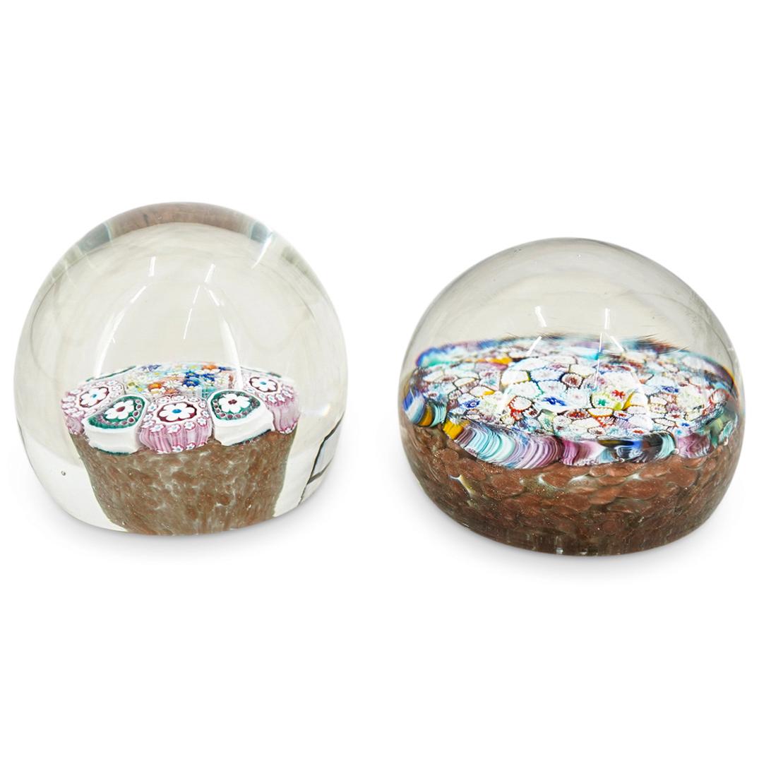 Murano Rondel Millefori Paperweights: DESCRIPTION: A pair of Murano glass paperweights with vibrant millefiori floral, rondel designs encased in colorless glass. Polished undersides. CIRCA: 20th Century ORIGIN: Italy DIMENSIONS: (H: 3" x 