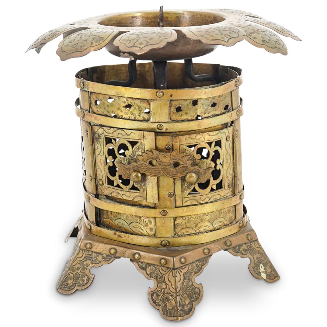 Meiji Japanese Copper Lotus Lantern: DESCRIPTION: Meiji Japanese copper lantern comprising of a lotus form top with petals etched with arc designs on a body with open scroll designed panels and hinged double doors, surmounting a six foot
