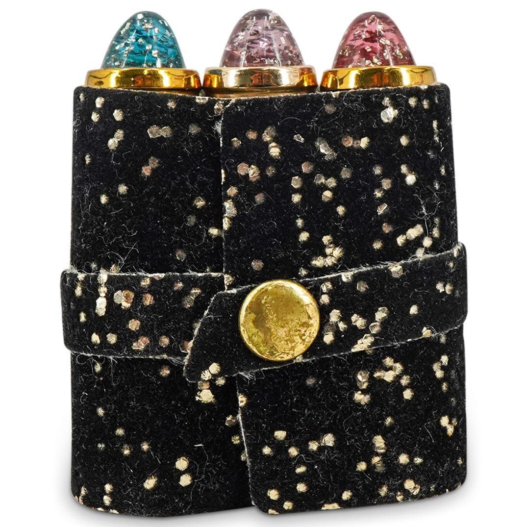 1950's Revlon Lipstick 3-Pc Set: DESCRIPTION: A vintage 1950's Revlon lipstick set of three (3) non-smear small bullet-shaped lipstick tubes with glitter accents. Includes the colors: 'Certainly Red'; 'Pink Lightning', and 'Bravo'. C