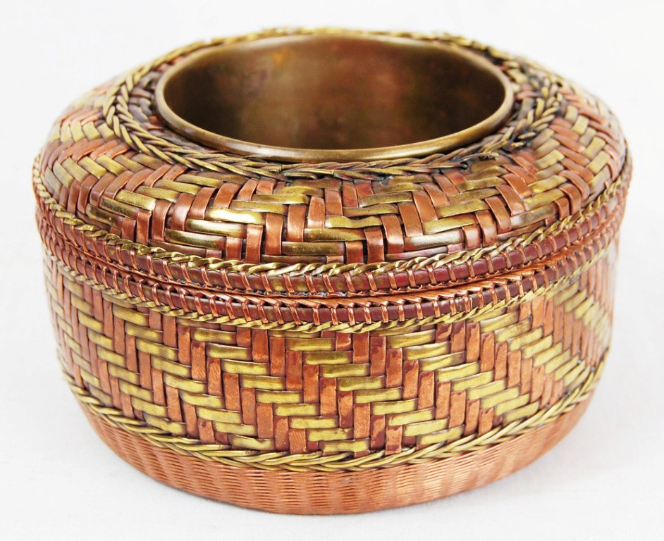 Woven antique copper and brass pot: DESCRIPTION: Woven copper and brass pot CIRCA: 1920s MADE IN: Middle East DIMENSIONS: H:3" L:5" RESERVE: None