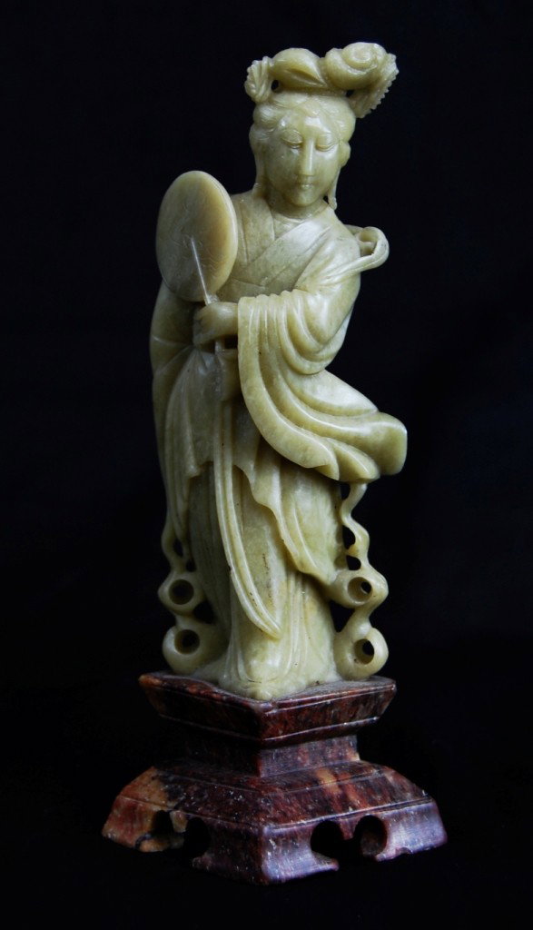 Chinese carved soapstone figurine: DESCRIPTION: Carved soapstone figurine of a woman CIRCA: 1940s MADE IN: China DIMENSIONS: H:6" L:3" including the base RESERVE: None