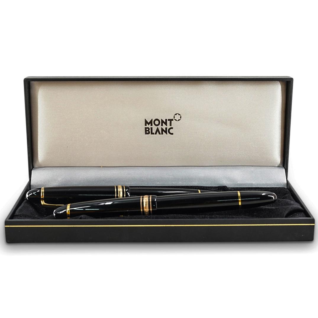 (2 Pc) Pair Of Montblanc Black Meisterstuck Ink Pens: DESCRIPTION: (2 Pc) A Pair of MontBlanc Black Meisterstuck fountain ink pens with characteristic gold trim 14K gold nibs, and MontBlanc signature white hallmark. Engraved "MontBlanc Meisterstuck". Mar