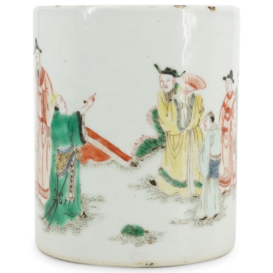 Chinese Famille Jaune Porcelain Brush Pot: DESCRIPTION: Famille jaune porcelain brush pot decorated with a garden scene populated by mandarins and courtiers socializing near a table. Marked on underside with the Han character for "lord". CIRCA