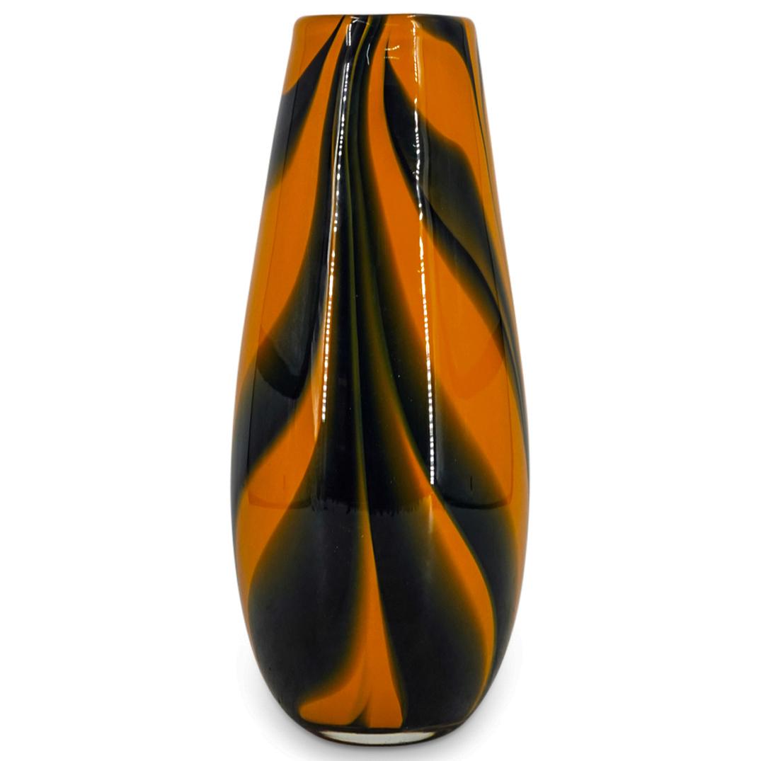 Feathered Murano Glass Vase: DESCRIPTION: Feathered Murano glass vase presenting a tapering deep yellow body with midnight blue feather designs. CIRCA: 20th Century ORIGIN: Italy DIMENSIONS: H: 14.37" D: 5.75" Have a similar item