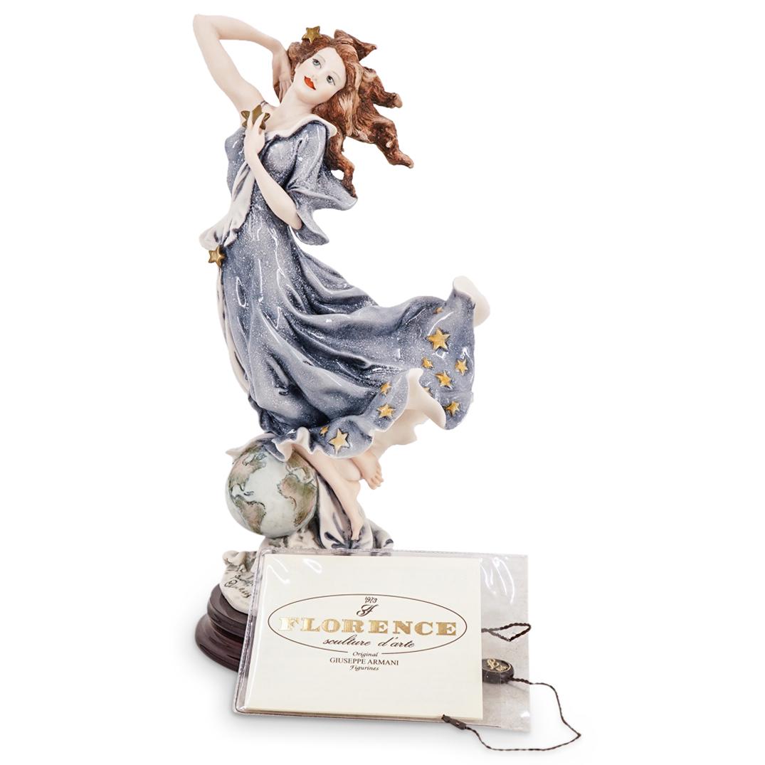 G. Armani "Celeste" Capodimonte Porcelain Figurine: DESCRIPTION: A Giuseppe Armani Capodimonte porcelain figurine. Model "Celeste" 2000 Figurine of the Year. With wooden base. Marked with the Capodimonte and Giuseppe Armani signature hallmarks. Marked 