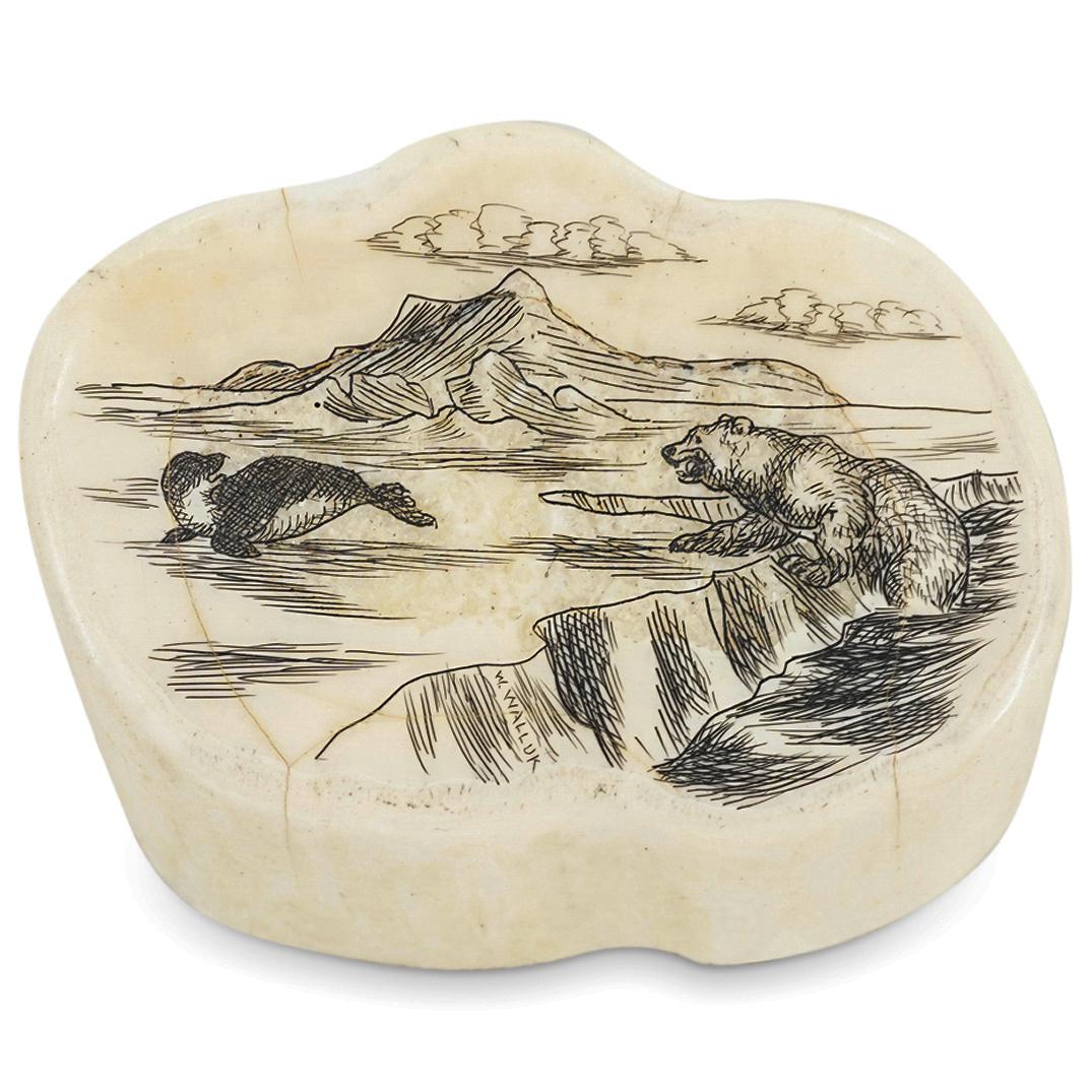 Wilbur Walluk (1928-1968) Scrimshaw Etching on Bone: DESCRIPTION: Scrimshaw etched bone by Inuit artist Wilbur Walluk (1928-1968); Depicting a polar bear chasing a seal on an ice with details of clouds at a distance. Signature lower "W. Willbur". CIRCA: