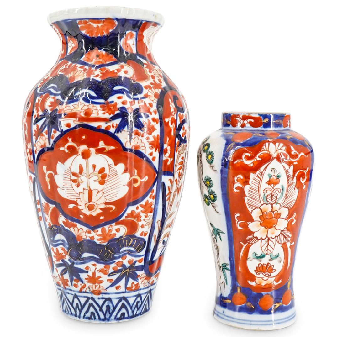 (2Pc) Antique Japanese Imari Porcelain Vases: DESCRIPTION: (2Pc) Antique Japanese imari porcelain vases each with gilt accents. Includes: (1) Vase comprising of a ribbed bulbous body enameled with depictions of trees and flowers with further flor