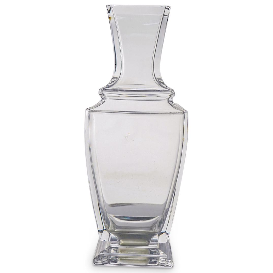 Baccarat Crystal "Pearl" Flower Vase: DESCRIPTION: A Baccarat crystal "Pearl" flower vase. Marked with "Baccarat" hallmark on the underside. CIRCA: 20th Century ORIGIN: France DIMENSIONS: H: 10 1/4" W: 3 3/4" Have a similar item to sell? 