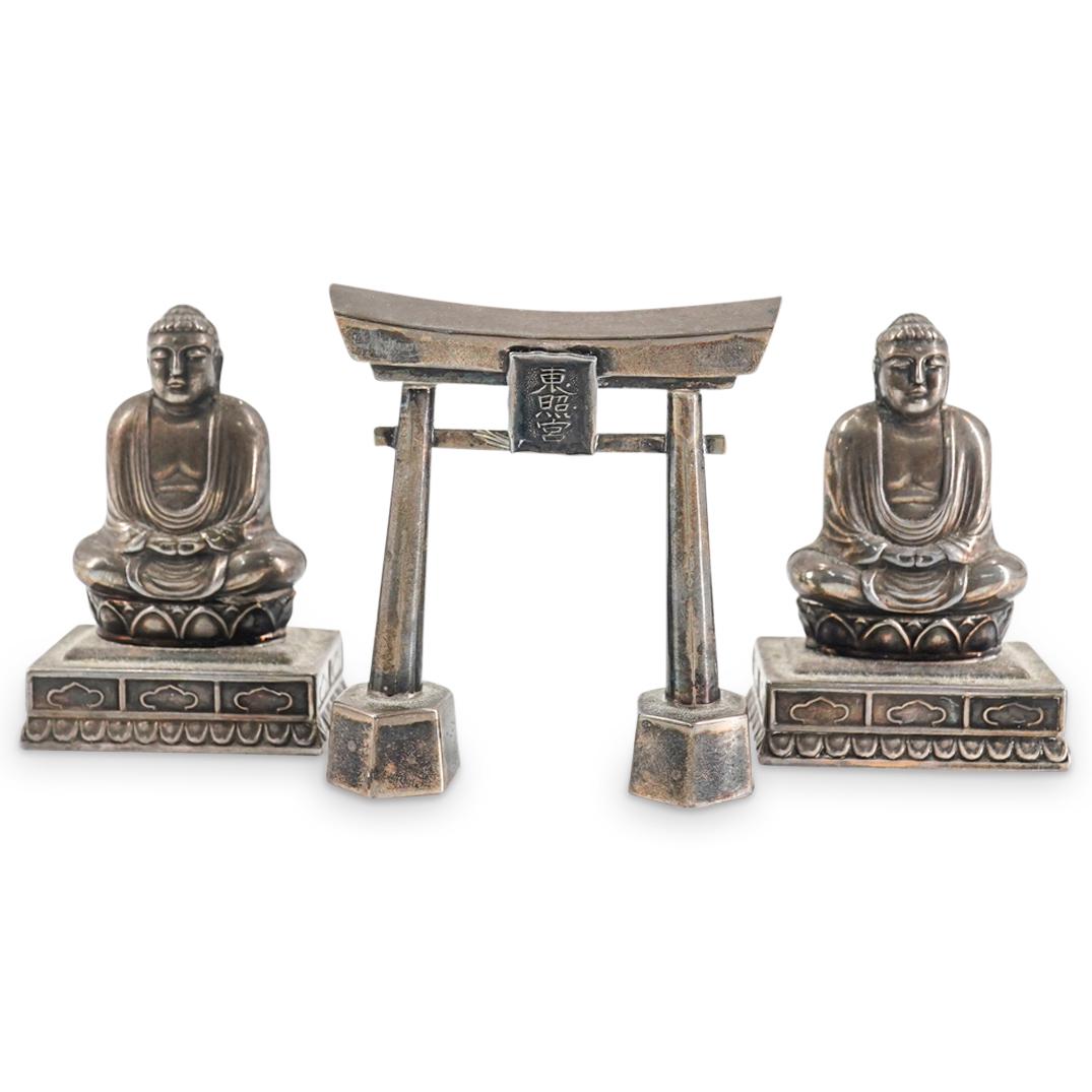 (3 Pc) Vintage Japanese Buddhist And Shinto Salt Cellars: DESCRIPTION: Three salt cellars, each composed of silver: one in the form of a Toshogu torii gate and fashioned of sterling silver, two depicting a meditating Gautama Buddha fashioned of 970 silver. T