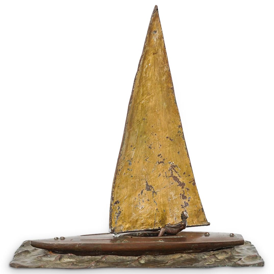 Antique Bronze Sailboat Sculpture Sculpture: DESCRIPTION: Antique bronze sculpture depicting a man seated and operating a small sailboat, mounted on a wave textured base, and completed with a parcel gilt sail. CIRCA: Early 20th Century ORIGIN: C