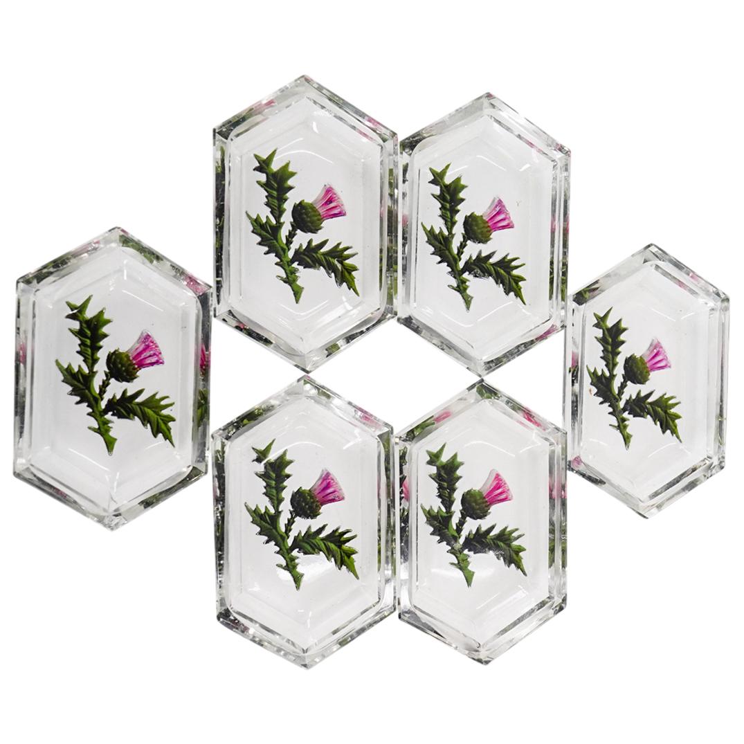 (6 Pc) Set Of Bohemian Glass Gilt Embossed Floral Salt Cellars: DESCRIPTION: Set of six Bohemian glass hexagonal salt cellars, each decorated on its underside with an embossed, painted, and gilt thistle design. CIRCA: 20th Century ORIGIN: Czechoslovakia DIMENSIONS
