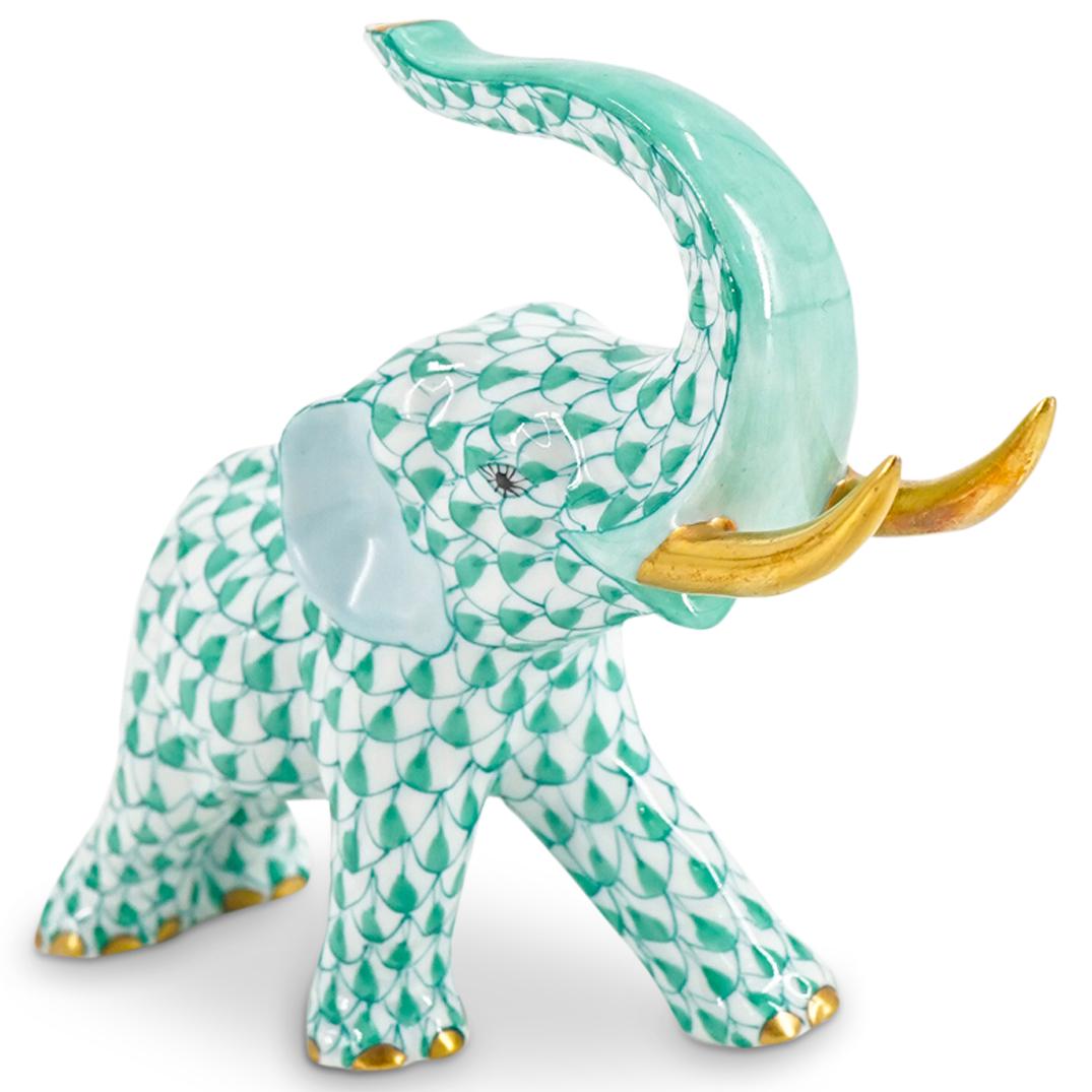 Herend Porcelain "Elephant" Green Fishnet Figurine: DESCRIPTION: Herend porcelain figurine of a "Elephant" embellished in a green hued fishnet pattern. Finished with gilded accents. Style:#5266. Marked along the underside with Herend stamps. CIRCA: 20t