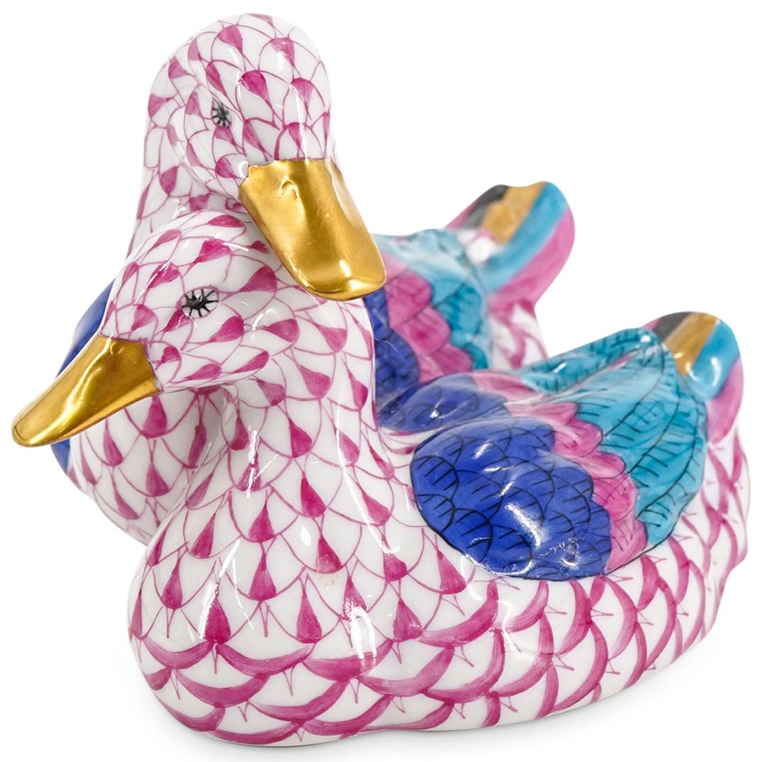 Herend Porcelain "Pair Of Ducks" Raspberry Fishnet Figurine: DESCRIPTION: Herend porcelain figurine of a "Pair Of Ducks" embellished in a raspberry hued fishnet pattern. Finished with gilded accents. Style:#5036. Marked along the underside with Herend stamps. C