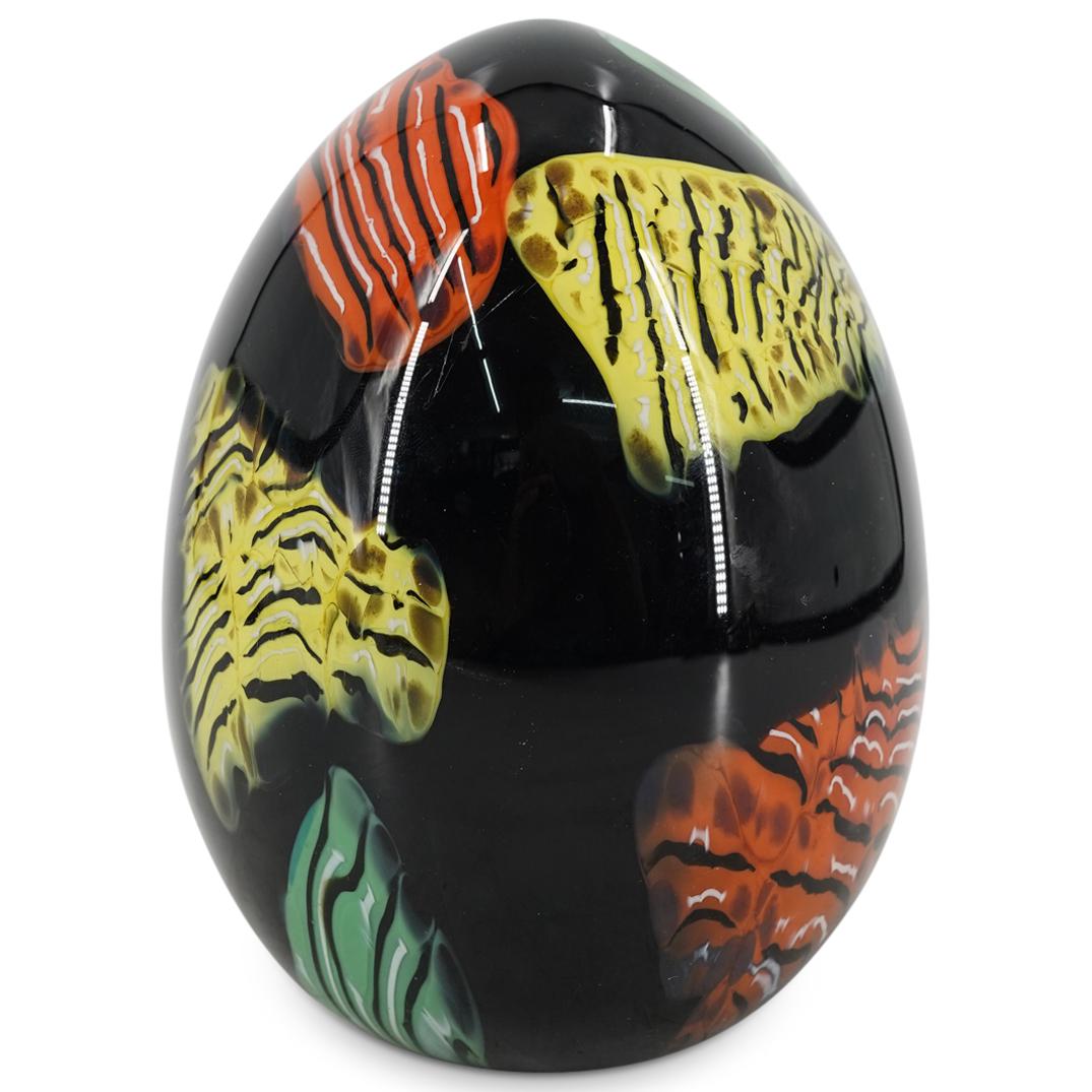 Seguso Murano Art Glass Egg Figurine: DESCRIPTION: Seguso Murano art glass egg figurine in black glass with matterned accents in green and orange. Marked with engraved signature "Seguso Murano" on the underside. CIRCA: 20th Century ORIGIN