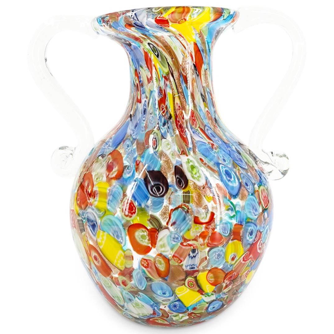 Murano Glass Polychrome Millefiori Handled Vase: DESCRIPTION: Murano glass vase featuring handles on either side of a bulbous clear body topped with a flared lip and decorated with stretched millefiori and aventurescent designs. CIRCA: 20th Century 