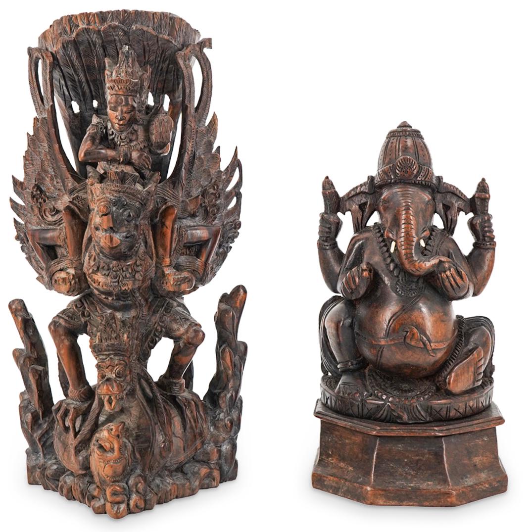 (2Pc) Southeast Asian Wood Carved Figures: DESCRIPTION: (2Pc) Southeast Asian wood carved figures depicting Ganesha on throne and Vishnu riding Garuda. CIRCA: 20th Century ORIGIN: Southeast Asia DIMENSIONS: (Vishnu) H: 13" x D: 7.5" (Ganesha) 