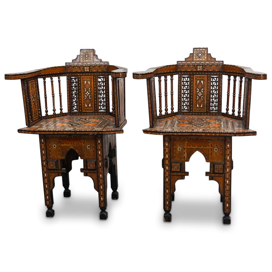 Pair Of Antique Syrian Parquetry And Mother Of Pearl Inlay Chairs: DESCRIPTION: Two matching wooden occasional chairs, each decorated throughout with intricate wooden khatam parquetry, bone, and and mother-of-pearl insets. Each piece an ornately fashioned back, legs,