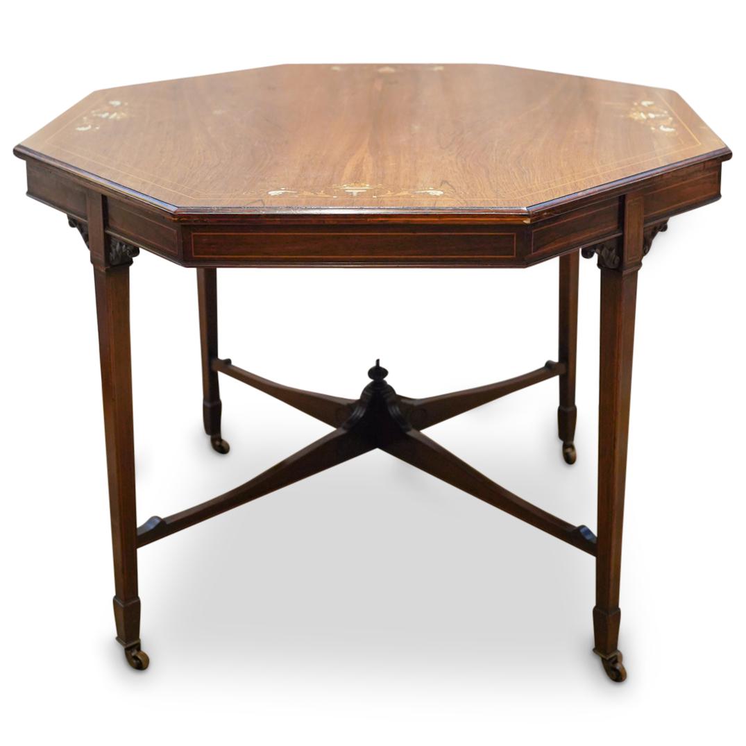 Antique English Rosewood Octagonal Marquetry Table: DESCRIPTION: English rosewood aesthetic movement table featuring an octagonal design decorated with marquetry urn and foliage designs embellished with bone insets. Finished with a windon finial at the