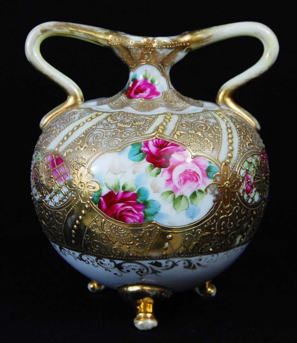Antique Nippon porcelain rose vase with gold overl: DESCRIPTION: Antique Nippon hand painted porcelain rose vase with gold overlay. 2 handles CIRCA: 1920s MADE IN: Japan DIMENSIONS: H:7" L:6" RESERVE: None