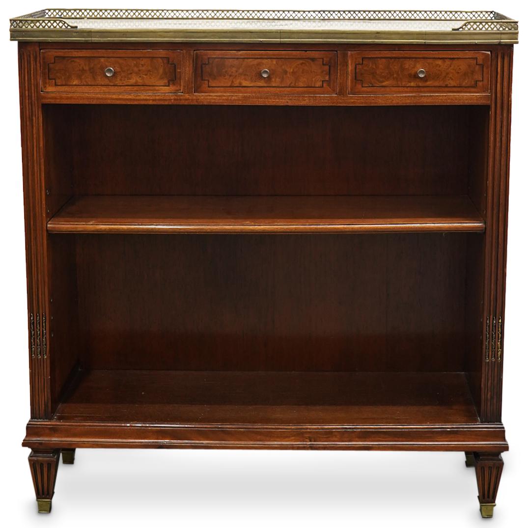 Mason Jansen Wood & Marble Shelf: DESCRIPTION: Maison Jansen marble topped shelf with lacquered wood foundation, designed with three side by side drawers above a single shelf case, completed on square and tapered feet. Impressed: "Jan