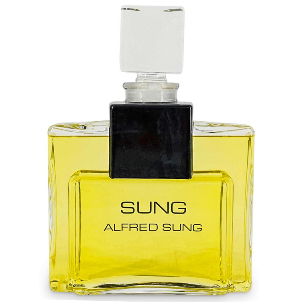 Large Display Alfred Sung "Sung" Factice Perfume Bottle: DESCRIPTION: A vintage large Alfred Sung "Sung" factice display dummy perfume bottle. CIRCA: 20th Century. DIMENSIONS: H: 10 1/2" W: 7 1/2". - CONDITION: Factice bottle. Does not contain real perfume.