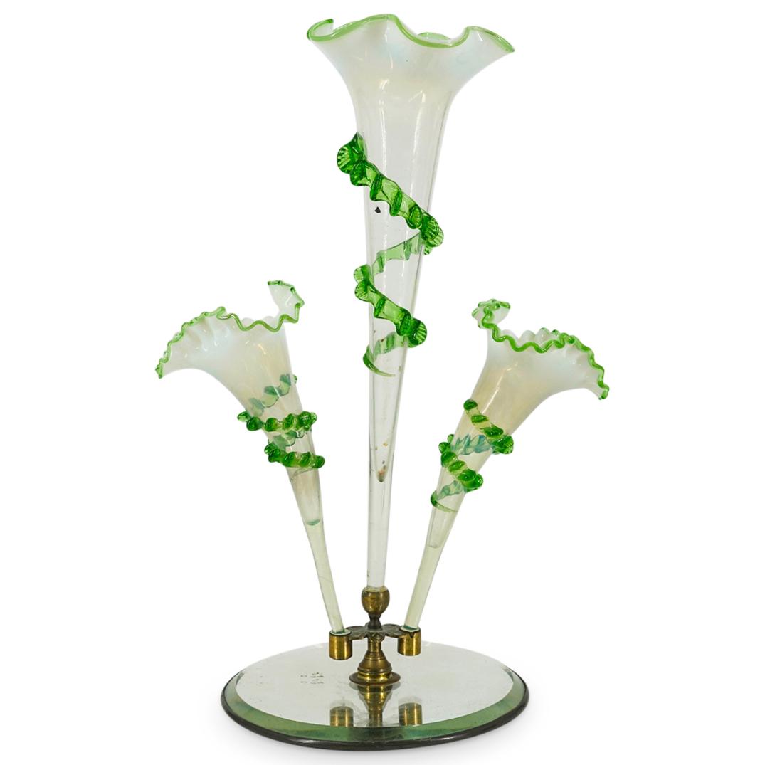 Victorian Glass Triple Epergne: DESCRIPTION: Victorian Epergne featuring three vases proper, each crafted with kerchiefed lips and a ribbed, green spiral around its body. Pieces are removable and are mounted onto a bronze stand atop