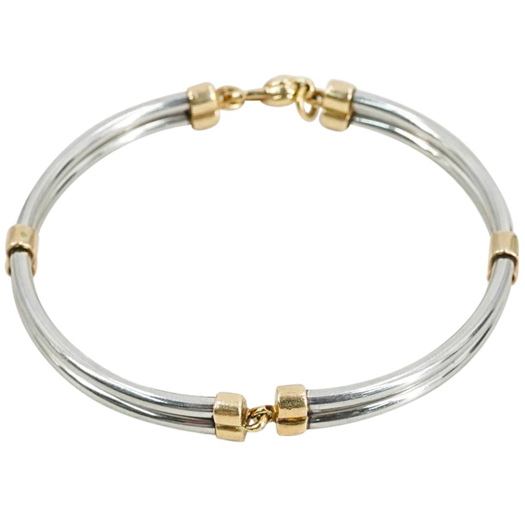 Vintage Sterling Silver & 18K Gold Bracelet: DESCRIPTION: Vintage sterling silver bracelet with 18K gold accents and clasp. Marked with hallmarks. CIRCA: 20th Century DIMENSIONS: W: 2 1/2". Weight: 17 grs. - CONDITION: Good pre-owned condition.