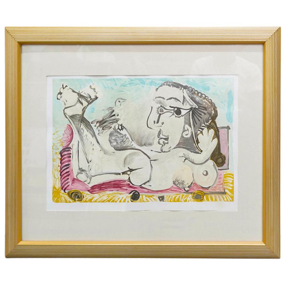 Pablo Picasso (1881-1973) Reclining Nude Lithograph: DESCRIPTION: Lithograph by Pablo Picasso depicting an abstract nude woman reclining on a couch. Mounted in a gilt wooden frame. CIRCA: 20th Century ORIGIN: Spain DIMENSIONS: (With Frame) H: 28" W: 1.2