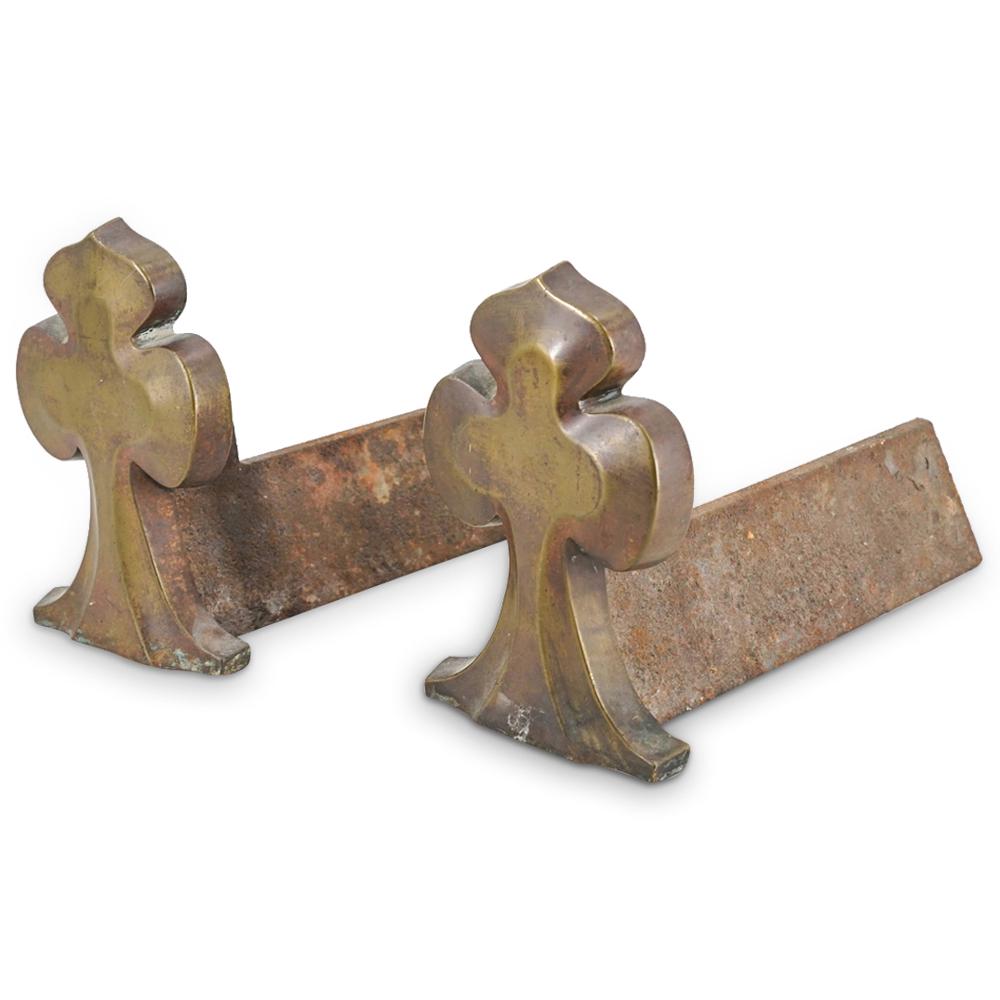 Pair Of Gothic Bronze And Iron Trefoil Andirons: DESCRIPTION: Two matching Gothic andirons, each featuring a bronze trefoil at its front. CIRCA: Mid to late 19th Century ORIGIN: European DIMENSIONS: H: 7.5" W: 4.75" L: 11.5" CONDITION: Great conditi