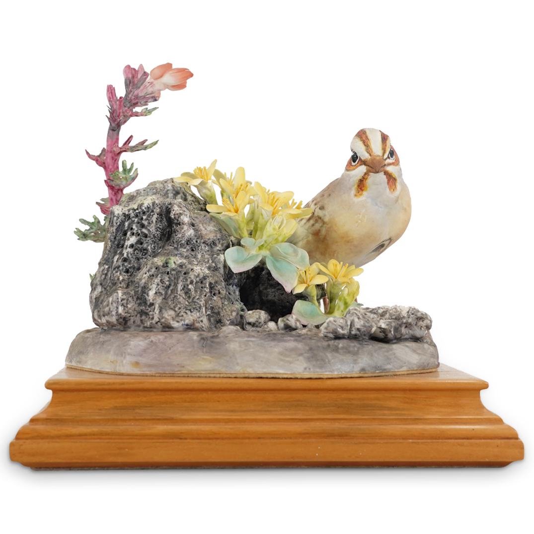 Royal Worcester "Lark Sparrow" Porcelain Bird Sculpture: DESCRIPTION: Royal Worcester porcelain sculpture by Dorothy Doughty of a lark sparrow perched on volcanic ash in which grow red gild and twinpod. Piece is marked on underside with title/bird name, Roy