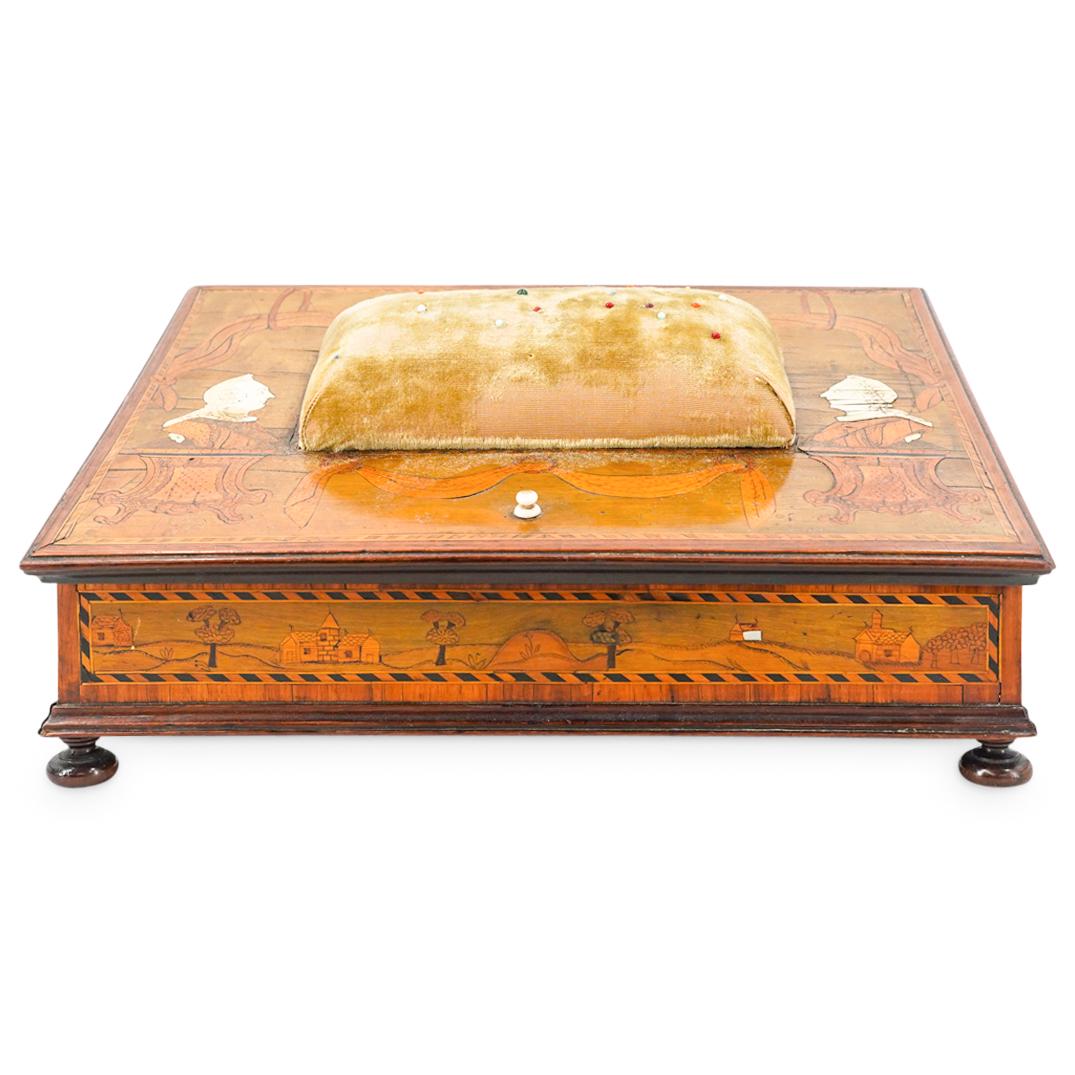 18th C. German Wood, Bone, Mother Of Pearl Marquetry Sewing Box: DESCRIPTION: Antique wooden sewing box adorned on its lid exterior with a large, oblong pin cushion and a mirror framed with parquetry on its lid interior. Exterior is decorated with marquetry designs