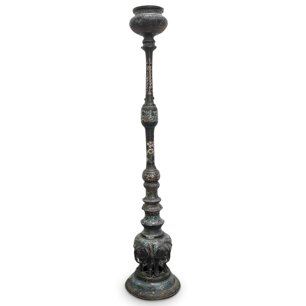 Antique Japanese Meiji Cloisonne Torchiere: DESCRIPTION: Antique Meiji torchiere featuring a body of varying shape fashioned with polychrome cloisonne accenting throughout depicting flowers, foliage, and geometric patterns. Segments sans enamel