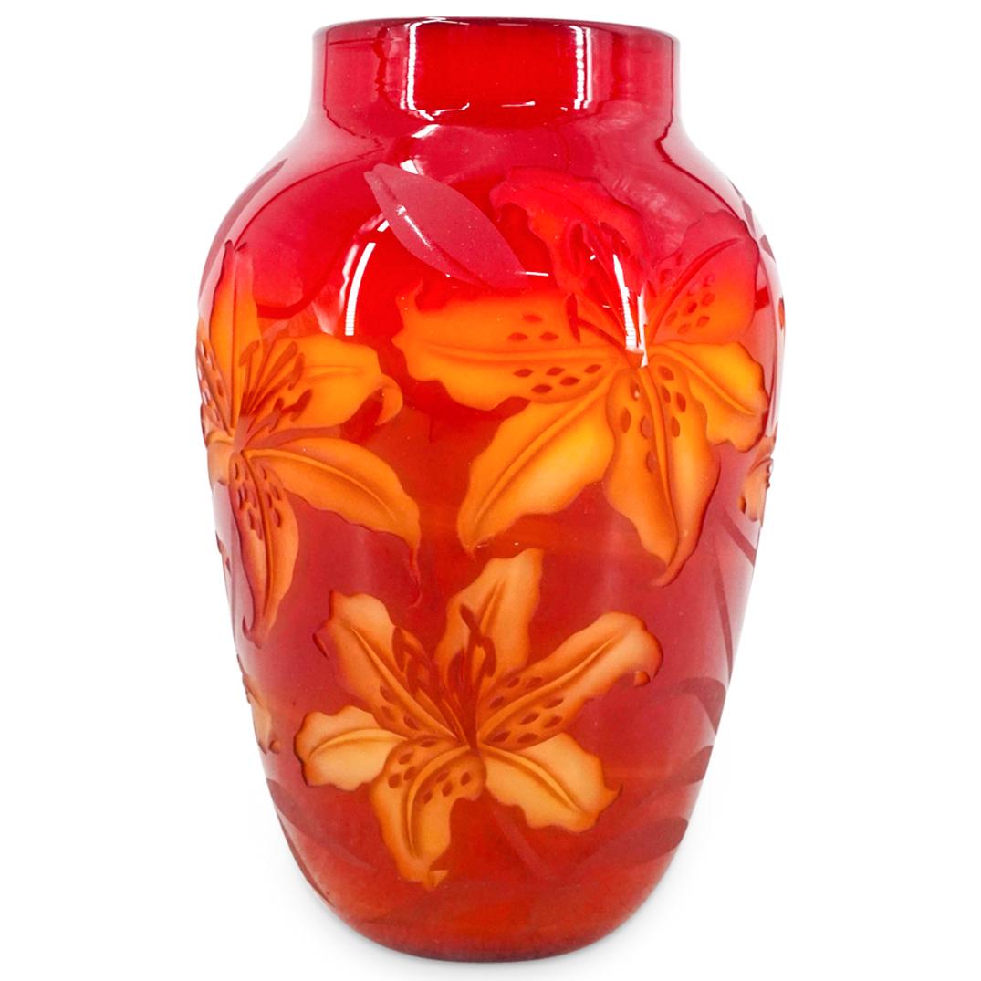 Valerie Surjan (American, 20th century) Cameo Glass Vase: DESCRIPTION: A Cameo glass vase by Valerie Surjan features in an overall red color with hints of yellow and amber. Decorated along the body with floral motifs. Signed "Valerie Surjan Nourot" and numbe