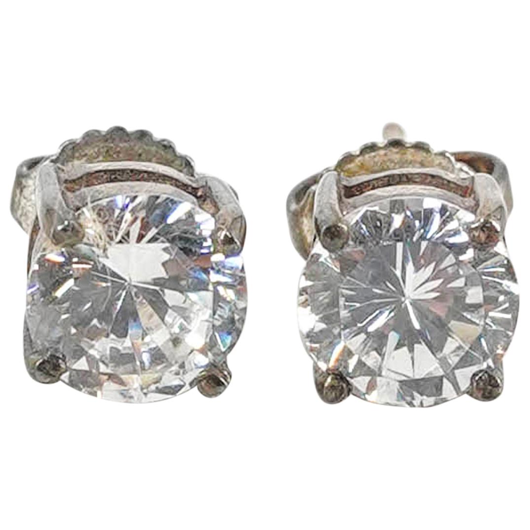 Ralph Lauren Sterling Silver Zirconia Earrings: DESCRIPTION: A Ralph Lauren sterling silver and zirconia round stud earrings. Marked "R.L. 925". Total Weight: 2.1 Grams. CIRCA: 20th Century. ORIGIN: USA DIMENSIONS: Total Weight: 2.1 Grams CONDITION