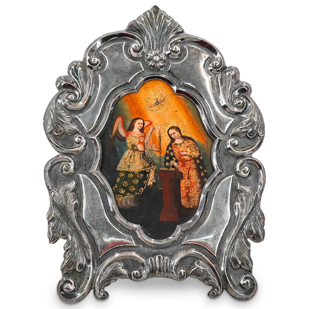 Antique Religious Oil On Board, Sterling Frame: DESCRIPTION: Antique colonial style oil on board painting depicting the Annunciation and featuring the Blessed Virgin Mary, the archangel Gabriel and the Holy Spirit in the form of a dove. In frame ma