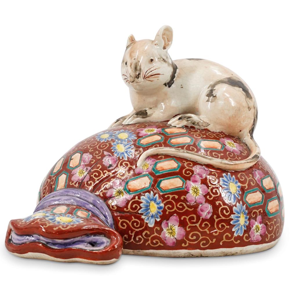 Ex-Christie's Chinese Porcelain Rat on Sack: DESCRIPTION: Chinese porcelain rat on sack with an overall red enamel and polychrome floral details, completed with a naturalistic rat. Character markings in red at underside. Christie's auction house
