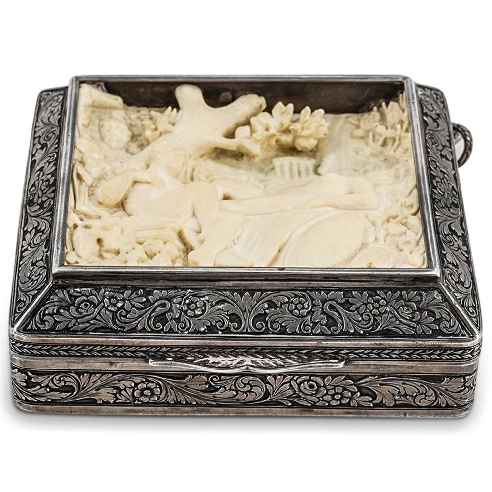 Antique Sterling Silver Box W/ Erotic Carved Inset: DESCRIPTION: Antique sterling silver hinged box featuring erotic carved inset. Inset depicts a neoclassical scene of two lovers, possibly Ares (Mars) and Aphrodite (Venus) reclining amongst foliage, w