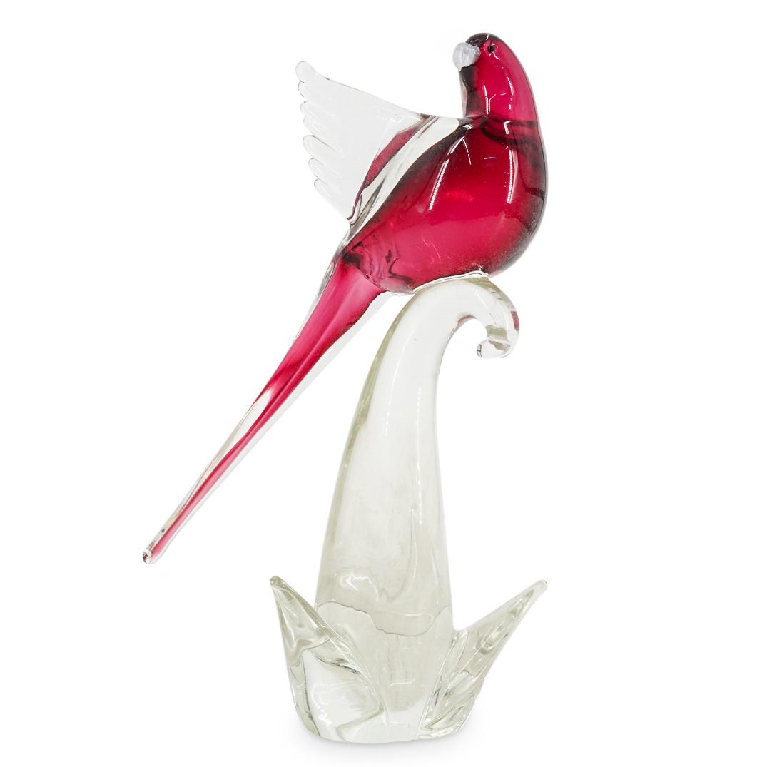 Murano Art Glass Magenta Bird Sculpture: DESCRIPTION: Murano glass sculpture depicting a bird figure perched on a branch. Features a magenta and clear Sommerso glass bird sculpture with clear colored wings, resting atop a clear glass base. B