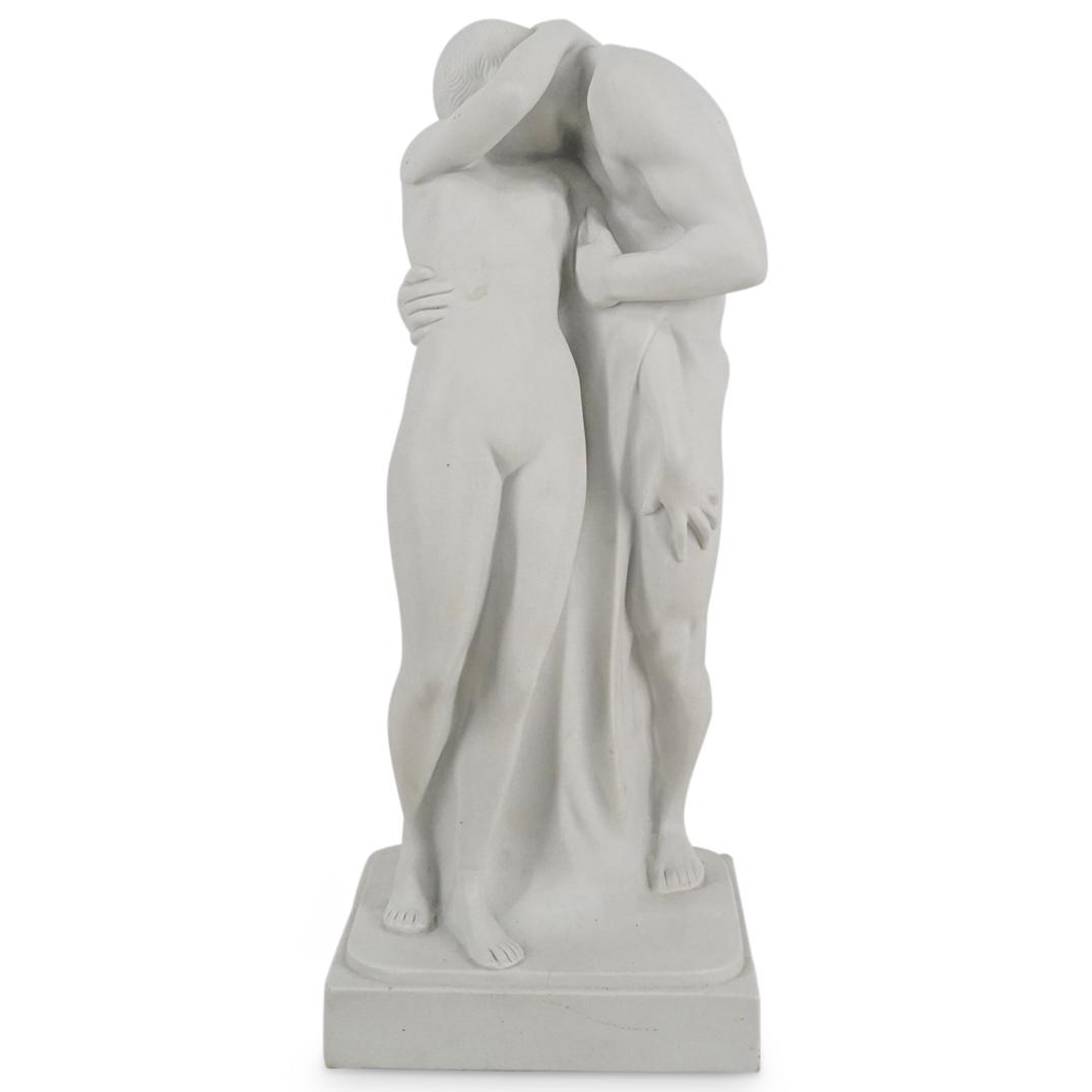After Wolfgang Schwartzkopff "Lovers" Volkstedt Bisque Porcelain Statue: DESCRIPTION: Volkstedt bisque (biscuit) porcelain statue after an early 20th Century design entitled "Lovers" by Wolfgang Schwartzkopff. Statue depicts a man and woman, both nude, as they embrace and 